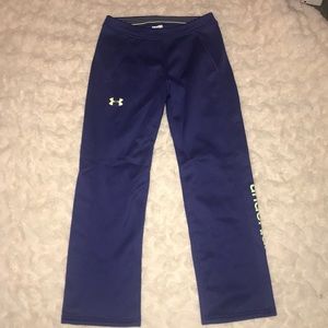 Purple and green under Armour sweatpants.